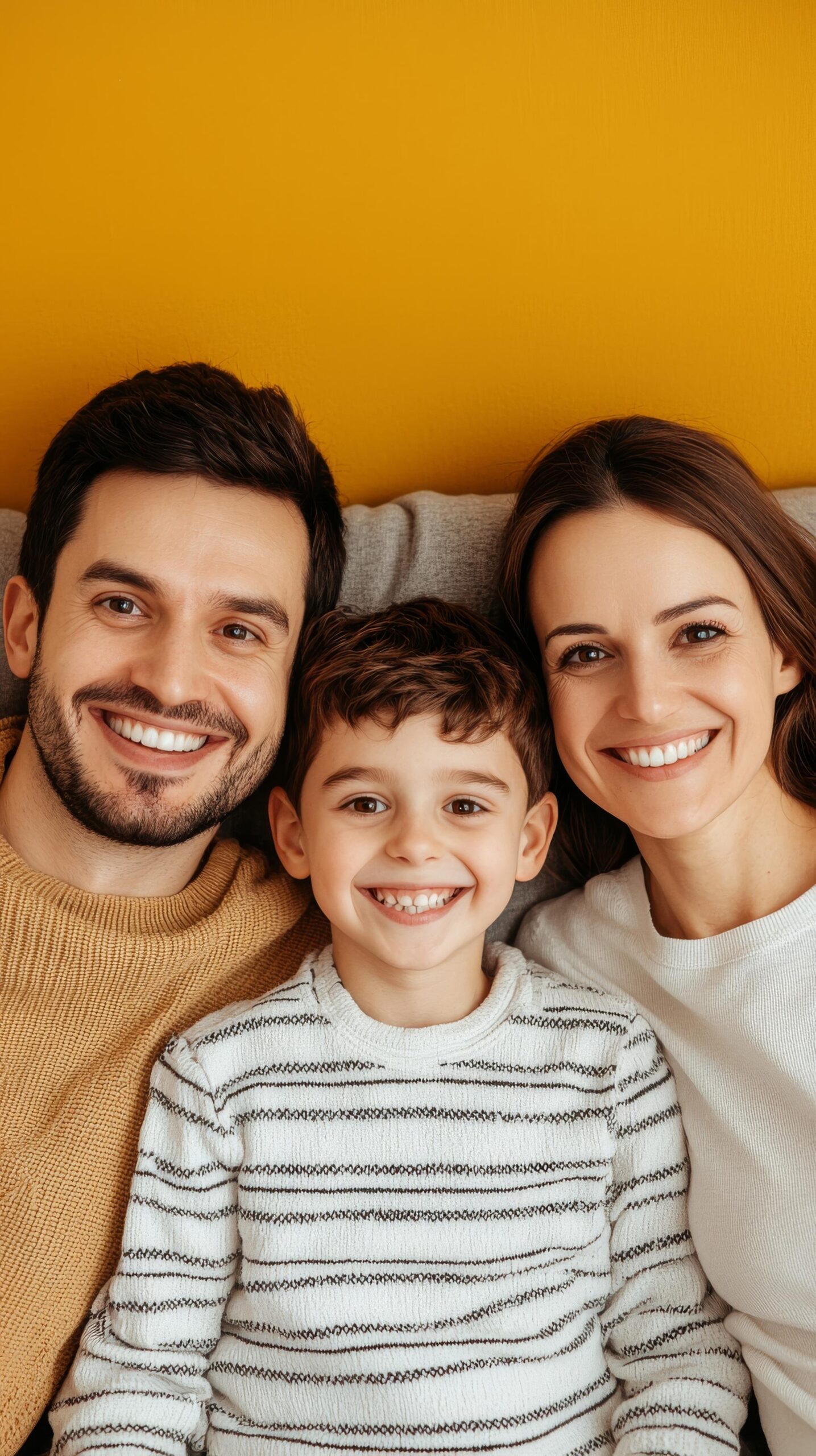 happy-family-portrait-with-smiling-boy-parents